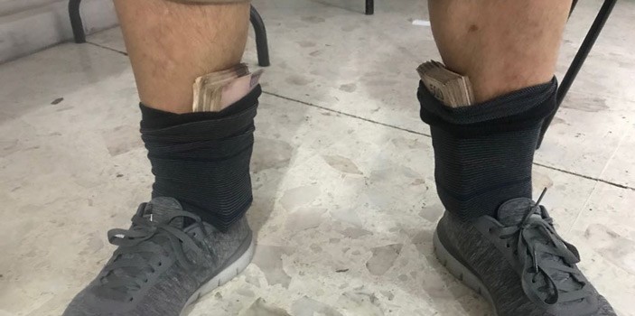 Escondía en sus calcetines y chamarra más de medio millón de pesos